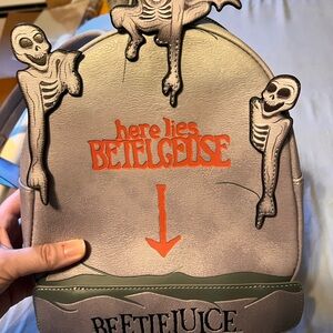Loungefly Gray and Red Beetlejuice Backpack glow in the dark